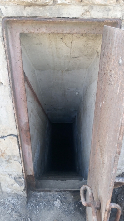 Photo 10 : Going down the dark gallery of an 1938 shelter