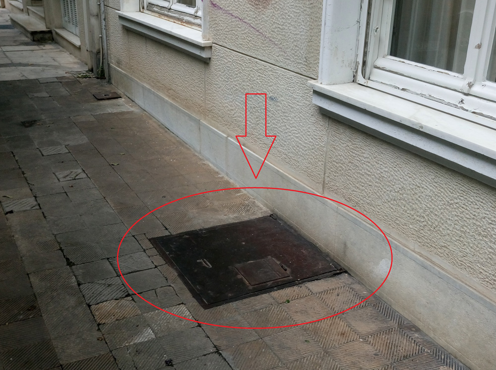Photo 18: A seemingly innocent lid in the pavement, is the emergency-exit of an old shelter